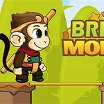 Małpa w stroju przygodowym stoi na platformie z mostem, obok napisu Bridge Monkey na tle z zielonymi wzgórzami