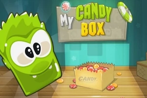 Zielony, uśmiechnięty żelkowy stworek obok kartonowego pudełka z cukierkami i kolorowym napisem My Candy Box