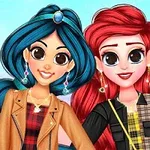 Dwie uśmiechnięte dziewczyny z dużymi oczami, jedna z długimi niebieskimi włosami i brązową kurtką, druga z czerwonymi włosami w czarnej kurtce, stoją na kolorowym tle