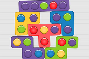 Kolorowe klocki o różnych kształtach i barwach z okrągłymi przyciskami ułożone w zwartą kompozycję na szarym tle