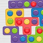 Kolorowe klocki o różnych kształtach i barwach z okrągłymi przyciskami ułożone w zwartą kompozycję na szarym tle