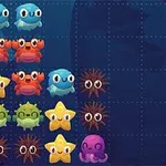 Kolorowe, uśmiechnięte morskie stworzenia, takie jak ryby, kraby, rozgwiazdy i ośmiornice, ułożone w rzędach na ciemnoniebieskim tle z siatką