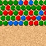 Kolorowe kulki w rzędach na beżowym tle