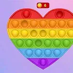 Tęczowa, sercowa zabawka pop-it na niebiesko-różowym tle z licznikiem monet u góry