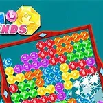 Logo SEA DIAMONDS i kolorowe, osadzone w ramce, błyszczące klejnoty na tle podwodnego krajobrazu z koralowcami