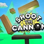 Scena z armatą, unoszącymi się drewnianymi skrzynkami i klockami w kolorowej, kreskówkowej grafice z napisem Shoot the Cannon