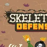 Napis Skeleton Defense na tle ziemi, otoczony czaszkami, kośćmi, butelką z płomieniem i bombą z czaszką