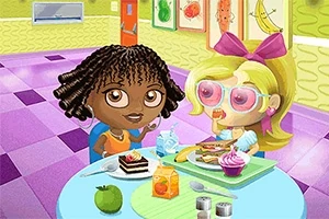 Dwie postacie siedzące przy stole jadalnym z jedzeniem, w kolorowym pomieszczeniu z plakatami owoców na ścianie