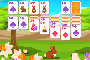 Kolorowa scena z kartami do gry z motywami wielkanocnymi i wiejskim krajobrazem z królikami i kurczakiem wśród kwiatów