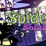 Ilustracja z wiedźmą przy kociołku, radosnym pająkiem oraz kartami, z napisem Spider Solitaire