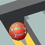 Czerwona kula z niebieskimi żyłkami tocząca się po ciemnoszarej ścieżce w kierunku żółtej gwiazdki