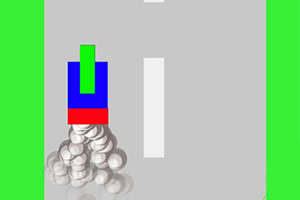 Prostokątne kształty w kolorach zielonym, niebieskim i czerwonym na szarej drodze z białymi liniami, otoczone zielonym tłem, z kulistymi obiektami z tyłu