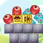 Kolorowe, futrzaste potworki i żółte postacie z otwartymi ustami ustawione na szarych metalowych skrzyniach w scenerii z zielonymi drzewami