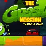 Zielona postać z uśmiechem i niebieskimi butami stoi obok czerwonej postaci na kolorowych blokach, z napisem The Green Mission Inside a Cave
