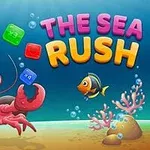 Homar z unoszącymi się kolorowymi bloczkami pod wodą i rybka na tle koralowców oraz dużego napisu The Sea Rush