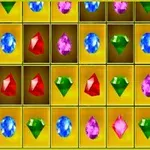 Kolorowe klejnoty ułożone w siatce na żółtym tle