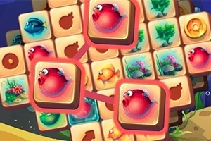 Kolorowe kafelki z grafiką przedstawiającą ryby i podwodne rośliny, z trzema czerwonymi rybkami wyróżnionymi na większych kafelkach