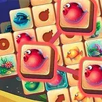 Kolorowe kafelki z grafiką przedstawiającą ryby i podwodne rośliny, z trzema czerwonymi rybkami wyróżnionymi na większych kafelkach