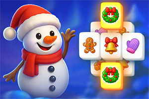 Bałwanek w czerwonym szaliku i czapce machający obok ułożonych klocków z symbolami świątecznymi, takimi jak dzwonek, piernik i wieniec