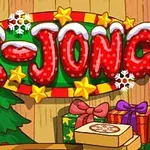 Kolorowy napis X-JONG z motywem świątecznym, ozdobiony gwiazdkami, śnieżynkami i otoczony prezentami oraz choinką