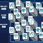 Układ płytek z symbolami znaków zodiaku na ciemnoniebieskim tle z czasomierzem i wynikami po lewej stronie