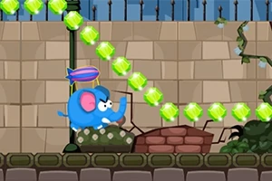 Niebieski słoń z różowymi uszami i unoszący się balonik, przemierza uliczkę z murem w tle, otoczony zielonymi klejnotami