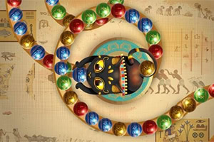 Czarna postać z otwartymi ustami otoczona kolorowymi kulkami na tle z egipskimi hieroglifami