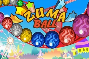 Kolorowe kulki na torze, z napisem Zuma Ball na tle wesołego miasteczka
